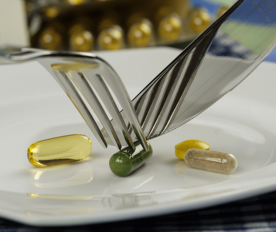 A plate with pills and a fork, representing iNewtrition's delivery systems for functional foods and beverages